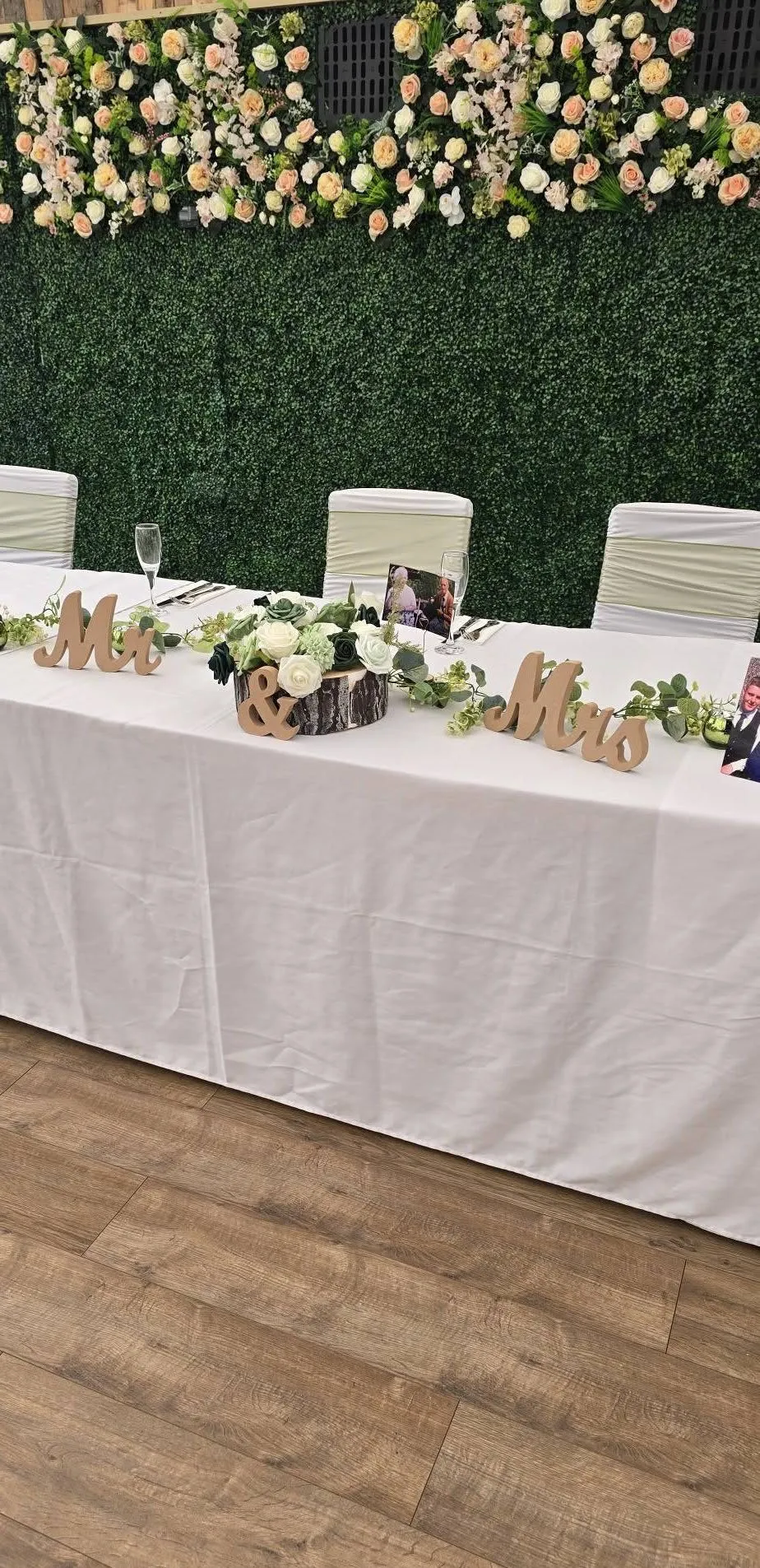 A dressed table against the flower wall