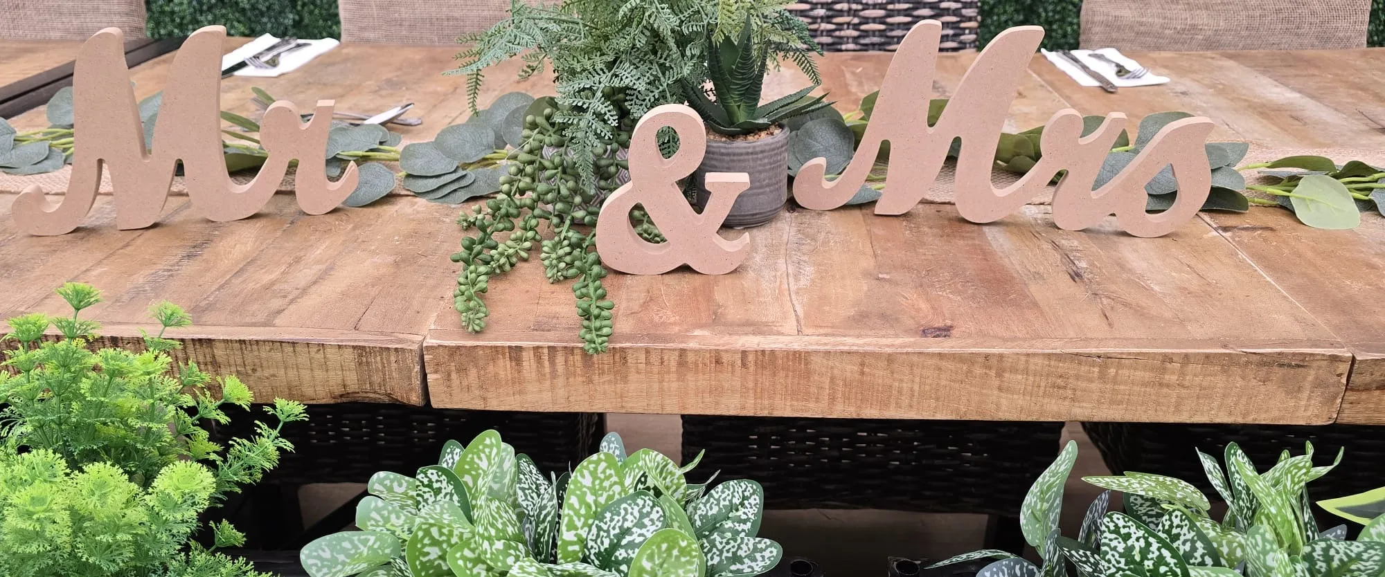Wooden Mr and Mrs letters with succulents and eucalyptus